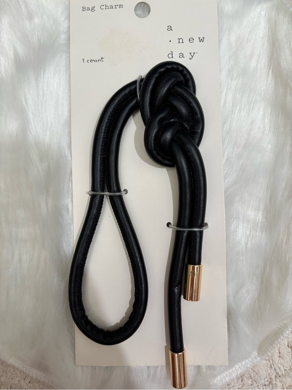 A New Day Black Knot Bag Charm with Gold Accents